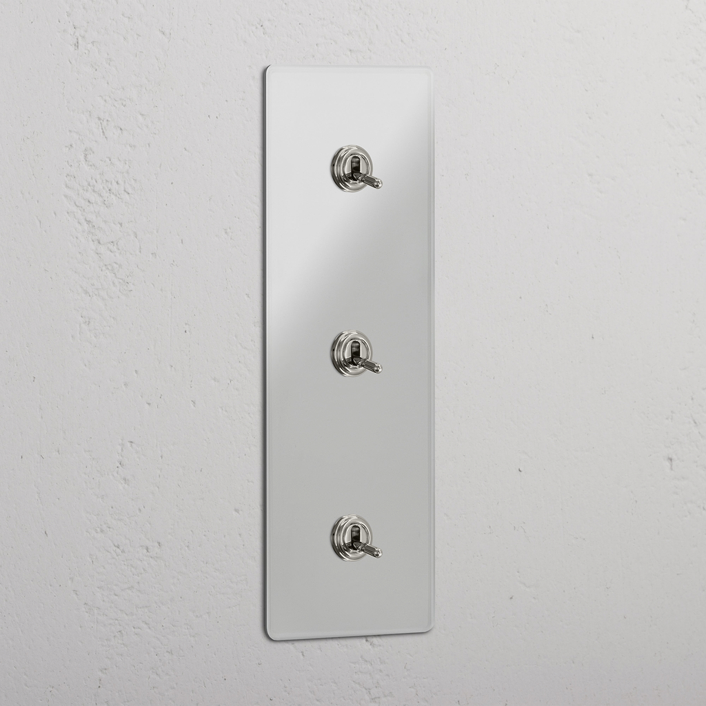 Interruptor triple de palanca en níquel pulido y traslúcido con diseño vertical - Accesorio de iluminación fácil de usar