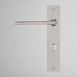 Manilla para puertas Clayton con placa larga (con muelle) y sistema giratorio - Níquel pulido