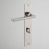 Manilla para puertas Clayton con placa larga (con muelle) y sistema giratorio - Níquel pulido