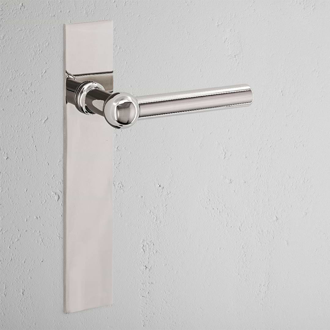 Manilla para puertas Harper con placa larga (con muelle) - Níquel pulido