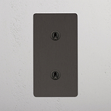 Double Vertical Toggle Switch in Bronze on White Background