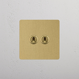 Dual Levers Toggle Switch, Single in Antique Brass on White Background