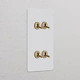 Interruttore a Levetta Doppio Verticale con quattro levette in ottone antico, design Pitturabile Ottone Antico.