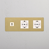 Prese Triple: Modulo Triplo USB 30W & 2x Schuko/Bipasso in finitura Ottone Antico Bianco, design elegante.