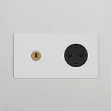 Doppio interruttore a levetta e modulo Schuko Tipo F con finitura ottone antico nero, verniciabile.