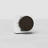 Bronzo Interruttore Dimmer Multidirezionale EU modulo: dimmer con grande manopola rotonda su superficie chiara.