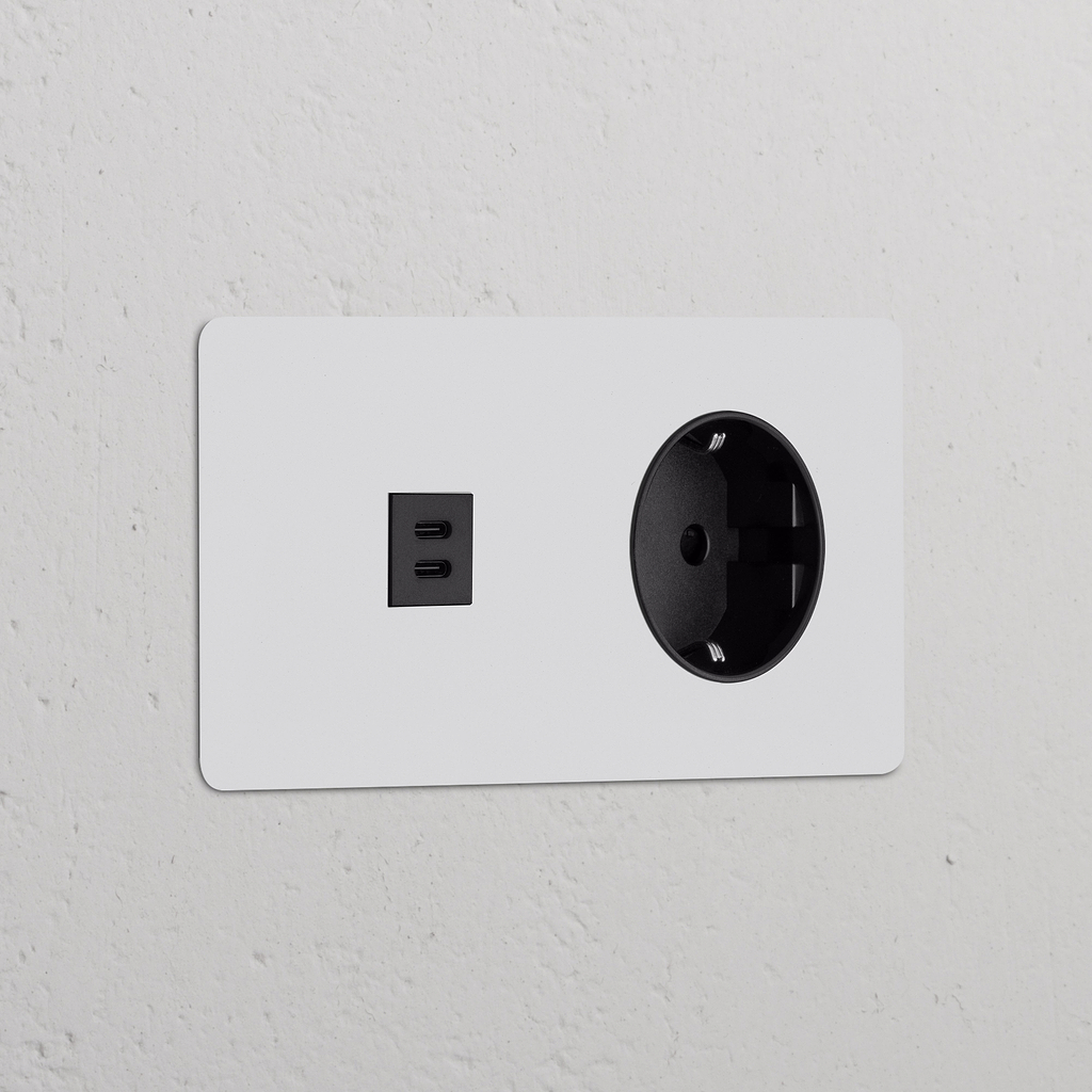 Módulo de alimentação redondo duplo USB 30 W e Schuko Tipo F, pintável em preto, para tomadas e módulos duplos.
