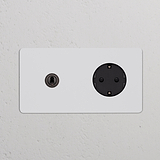 Módulo duplo redondo com interruptor articulado e tomada Schuko Tipo F, bronze pintável preto.