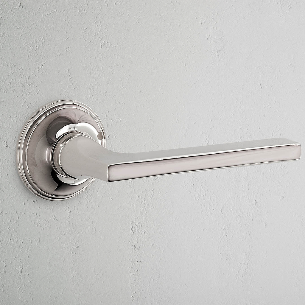 Clayton Sprung Door Handle Polished Nickel Finish on White Background 