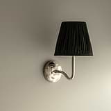 Medium Malvern Wall light in Deep Green at an angle and affixed to a wall 