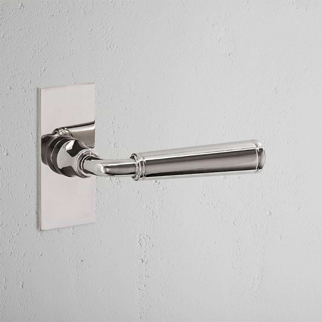 Digby Short Plate Sprung Door Handle Polished Nickel Finish on White Background