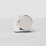 Polished nickel multiway EU dimmer switch module with large circular knob on light background.