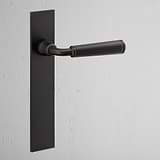 Digby Long Plate Sprung Door Handle Bronze Finish on White Background