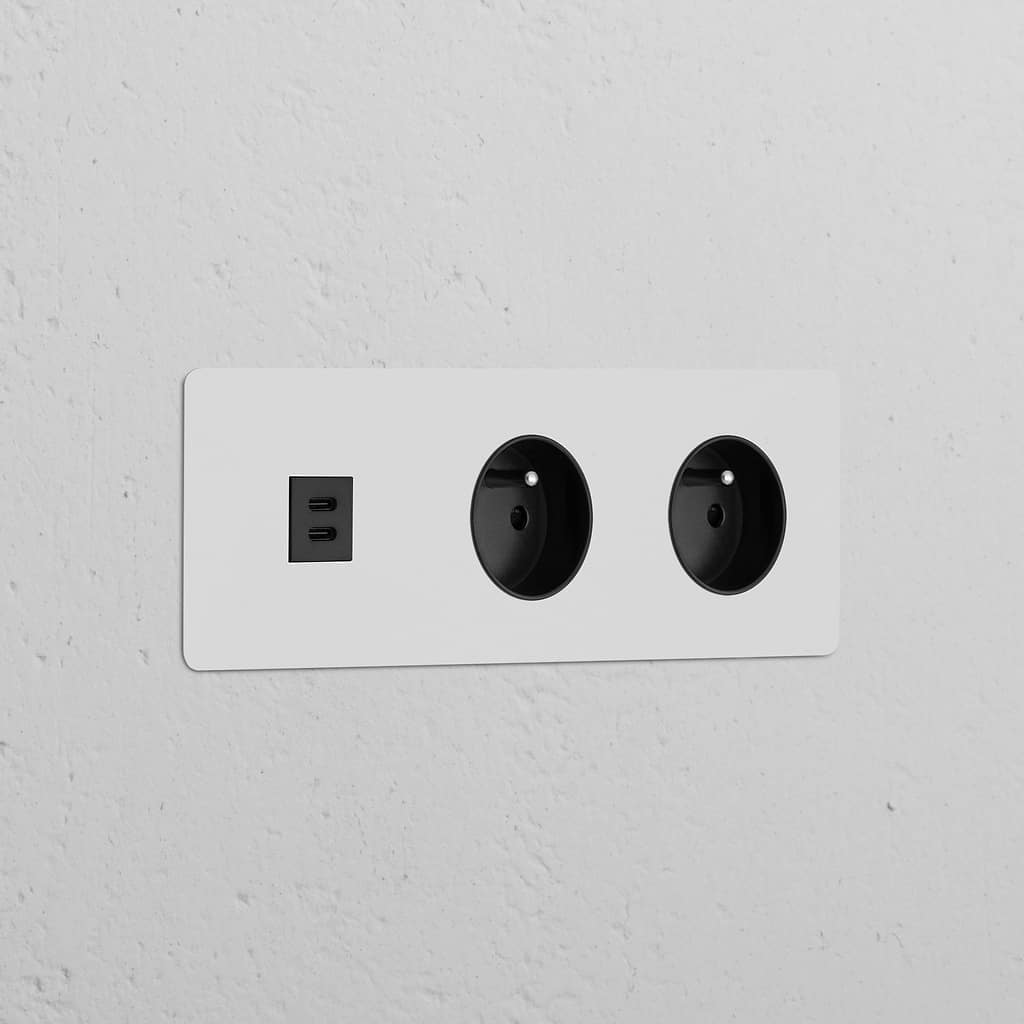 Round black module with 2 Type E sockets and triple USB 30W, paintable for custom finish in French/Belgian style.