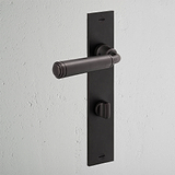 Digby Long Plate Sprung Door Handle & Thumbturn Bronze Finish on White Background at an Angle