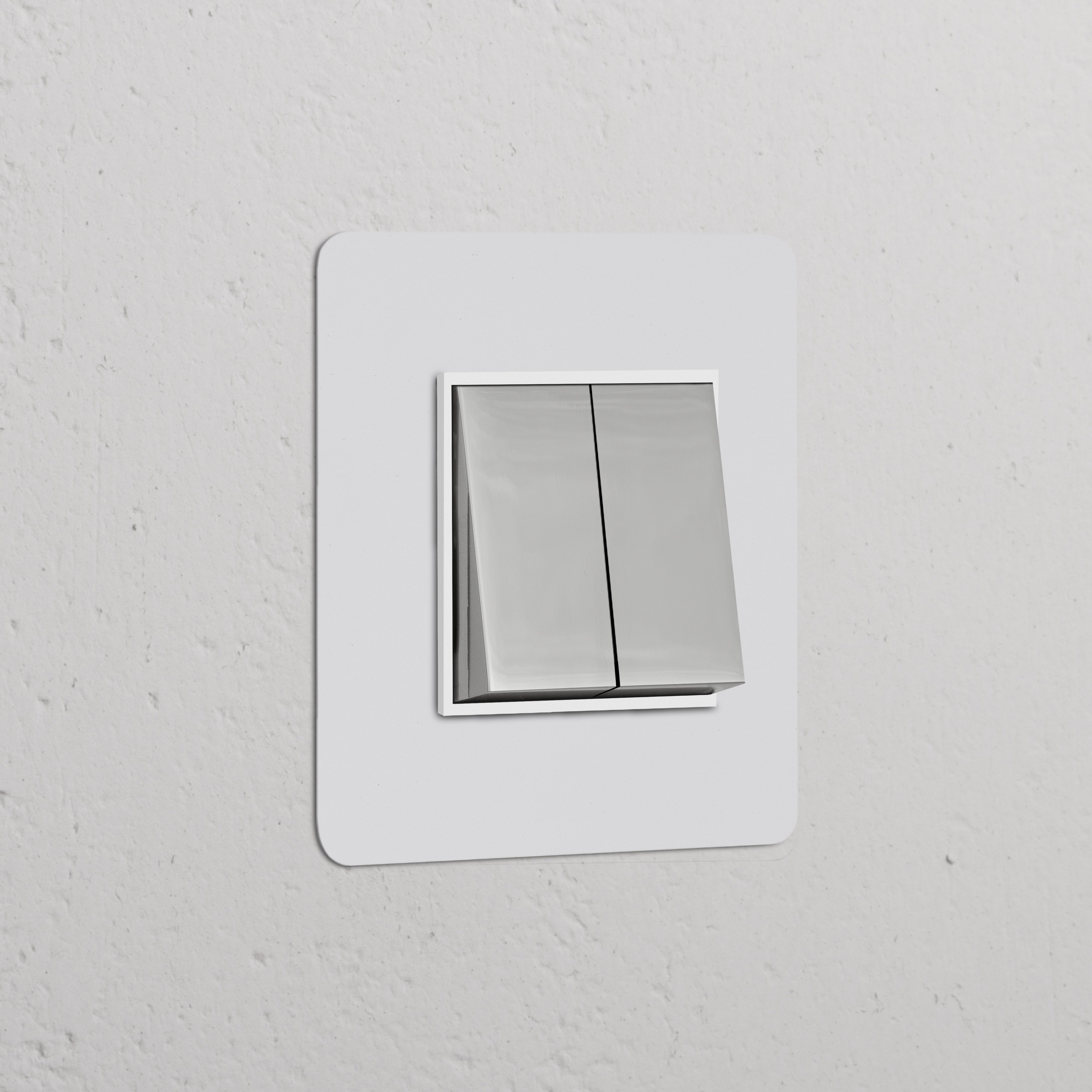 Paintable polished nickel white single 2x rocker switch on a textured white wall.