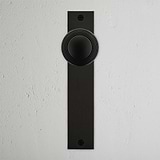 Poplar Long Plate Sprung Door Knob Bronze Finish on White Background right Facing Front View