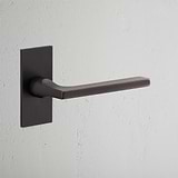 Clayton Short Plate Fixed Door Handle Bronze Finish on White Background