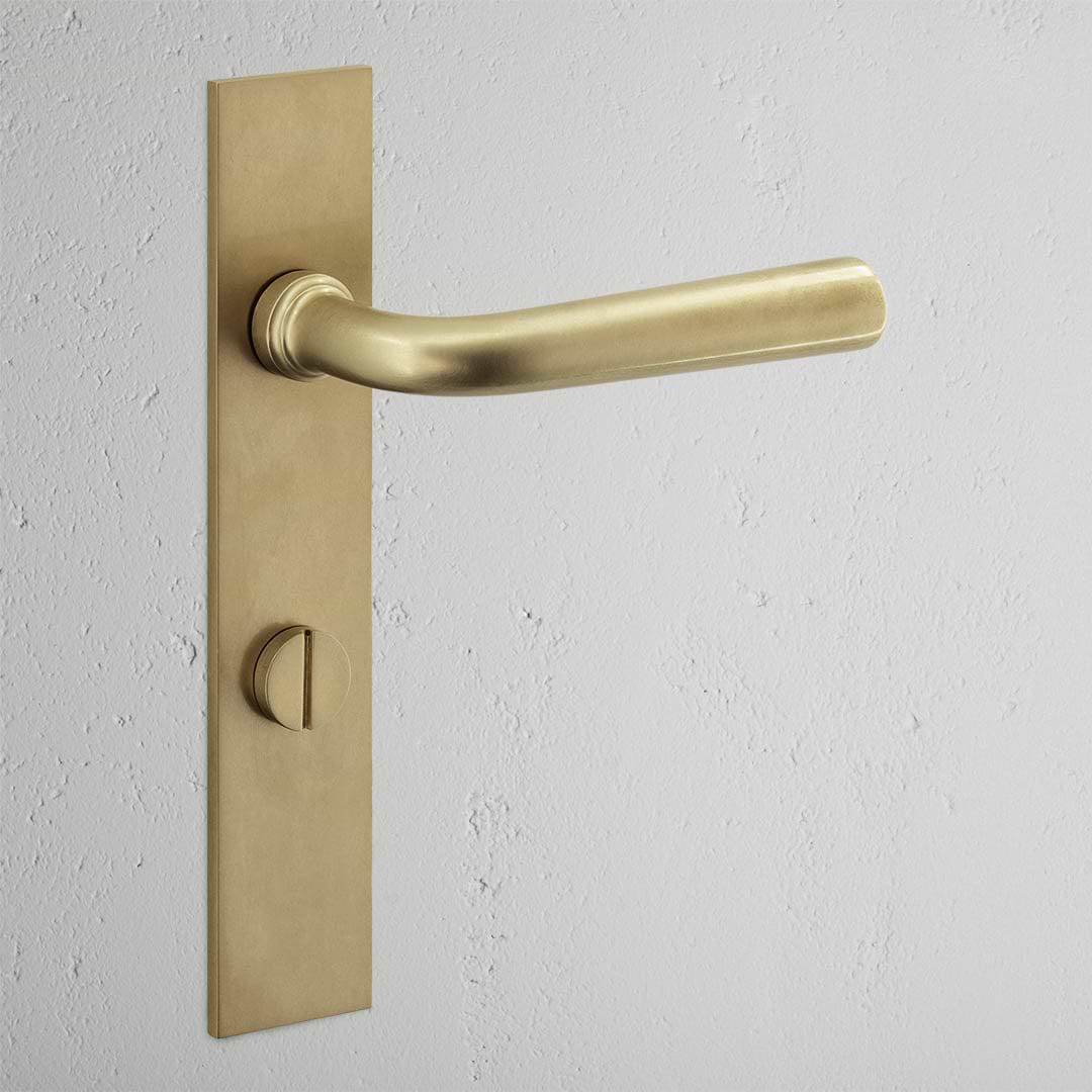 Apsley Long Plate Sprung Door Handle & Thumbturn Antique Brass Finish on White Background 