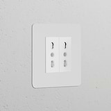 Single 2x Bipasso Power Module in paintable white, features childproof double electrical sockets for single use.