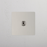 Intermediate Light Toggle Switch on White Background: Polished Nickel Single Toggle Switch (Int)