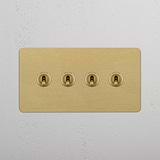 Four-Toggle Double Switch in Rich Antique Brass on White Background