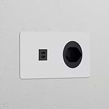 Sleek Double USB 30W & Swiss Type J Power Module in round, paintable black design for wall sockets & modules.