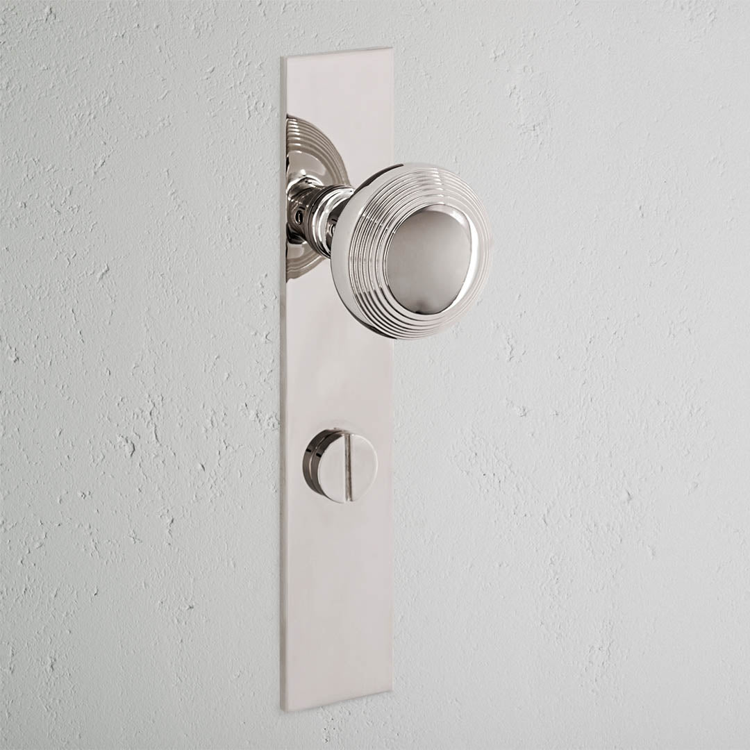 Poplar Long Plate Sprung Door Knob & Thumbturn Polished Nickel Finish on White Background 