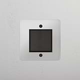 Versatile Intermediate Single Rocker Switch in Clear Bronze Black for Light Control on White Background