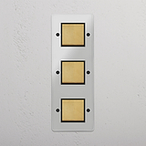 Vertical Triple Rocker Switch in Clear Antique Brass Black - Home Lighting Control Solution on White Background