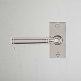Digby Short Plate Sprung Door Handle Polished Nickel Finish on White Background right Facing Front View
