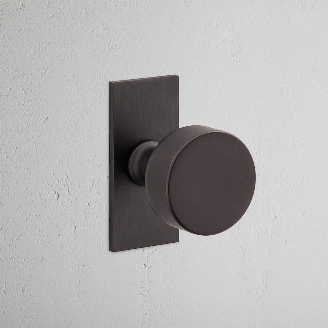Onslow Short Plate Sprung Door Knob - Bronze