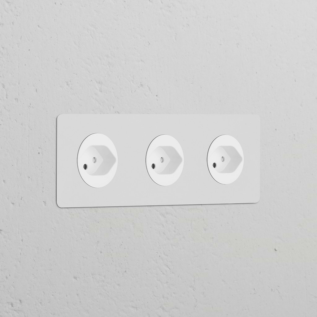 Triple 3x Swiss Type J Power Module with round paintable white sockets, seamlessly integrated into a white wall.