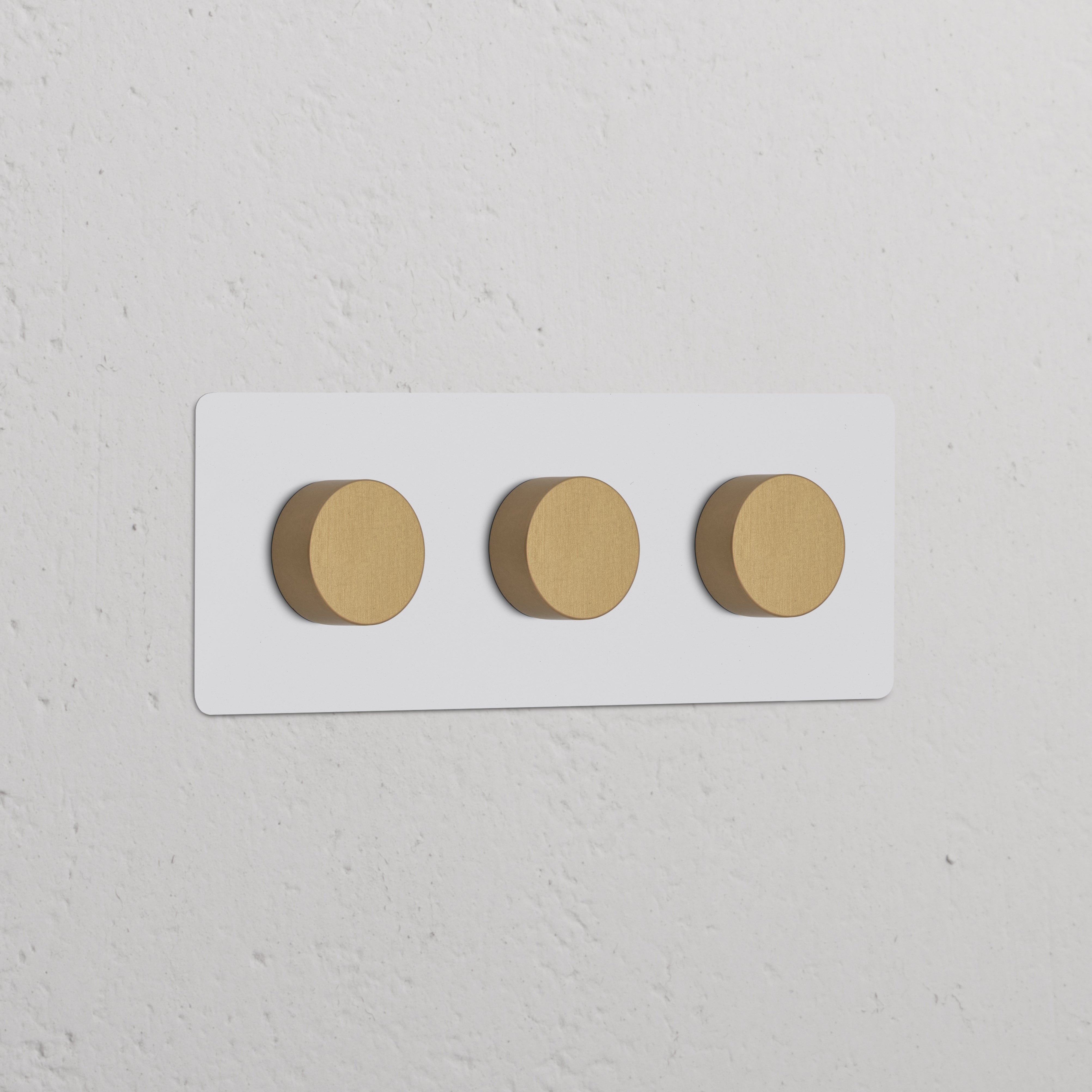 Triple 3x Dimmer Switch in paintable antique brass finish, featuring three round knobs on a rectangular panel.