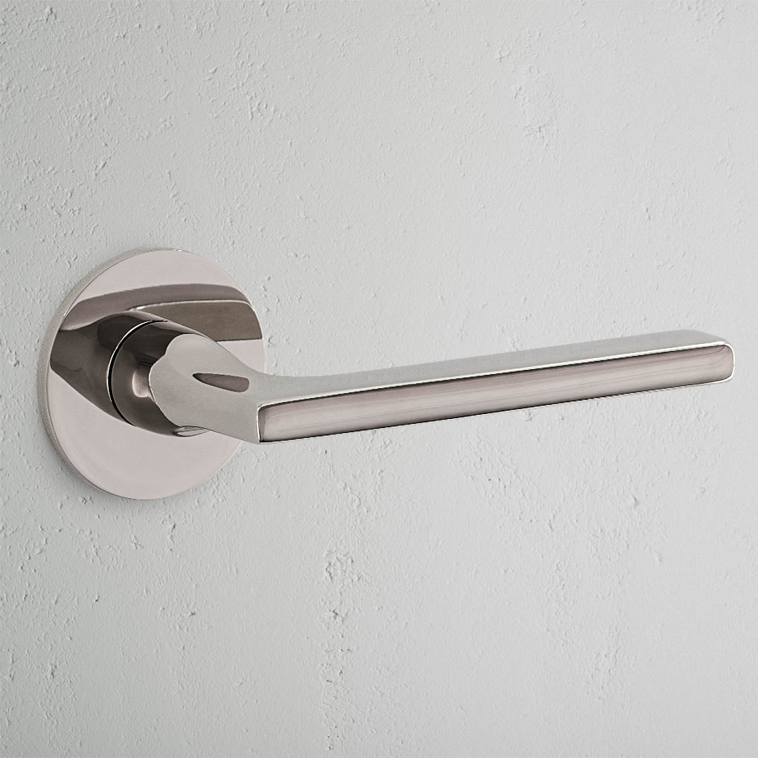 Clayton Sprung Door Handle With Flush Rose - Polished Nickel