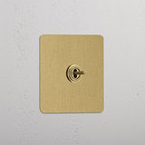 Central Single Toggle Switch in Antique Brass