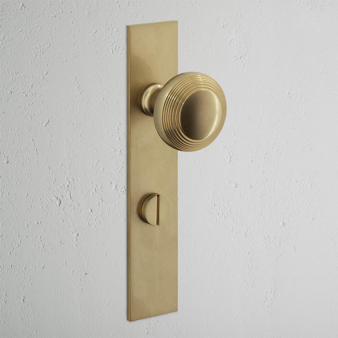 Poplar Long Plate Sprung Door Knob & Thumbturn - Antique Brass