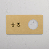 Antique Brass White Double Sockets & Modules with Double 2x Toggle on a white textured wall.