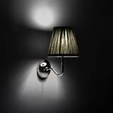Small Malvern Wall Light in Deep Green at an angle and turned on at night