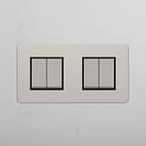 High Capacity Quad Control Light Switch: Four-Way Rocker Switch in Polished Nickel Black on White Background