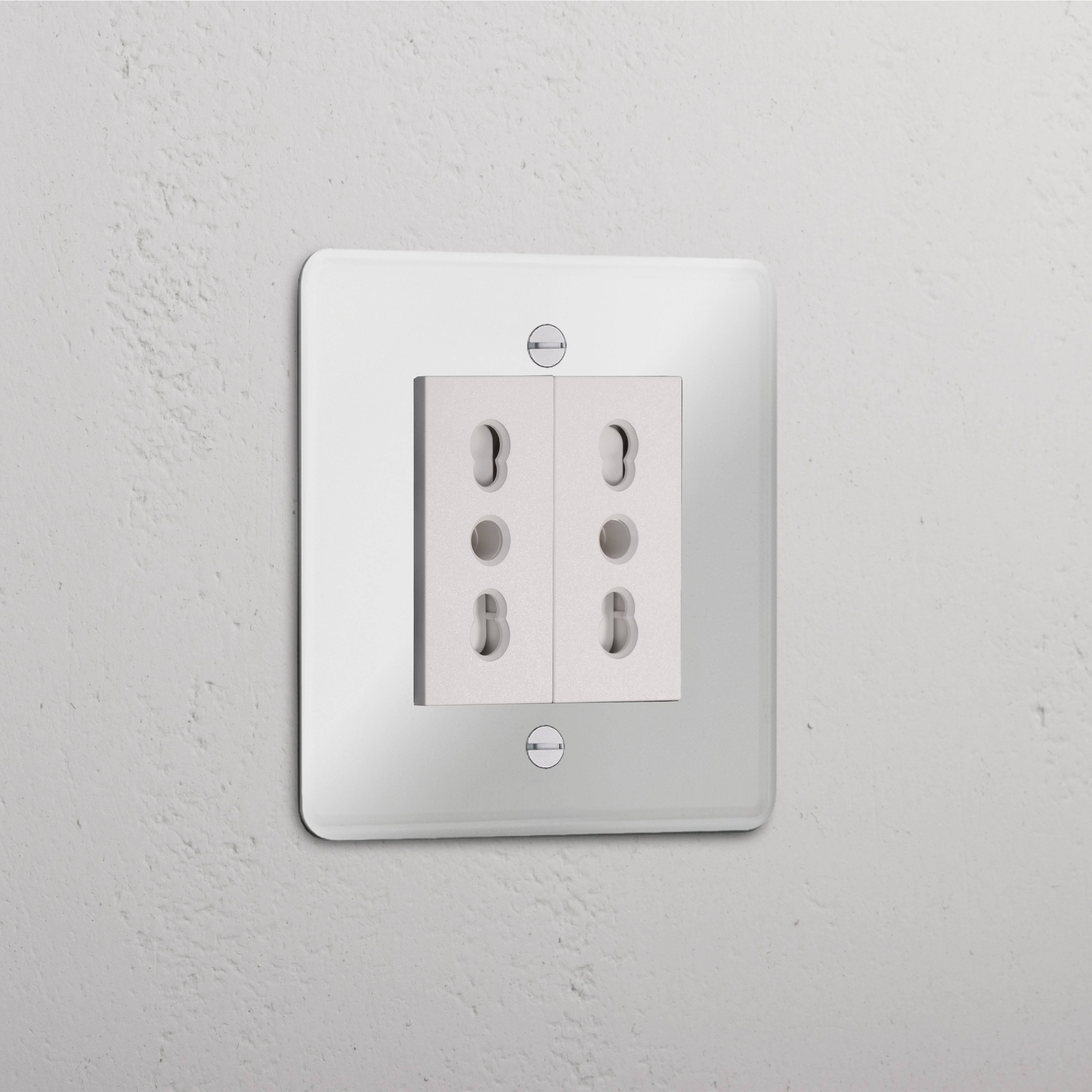 Clear white single socket with 2x Bipasso module, featuring four plug openings on a flat wall surface.