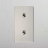 Dual Vertical Light Toggle Switch on White Background: Polished Nickel Double 2x Vertical Toggle Switch