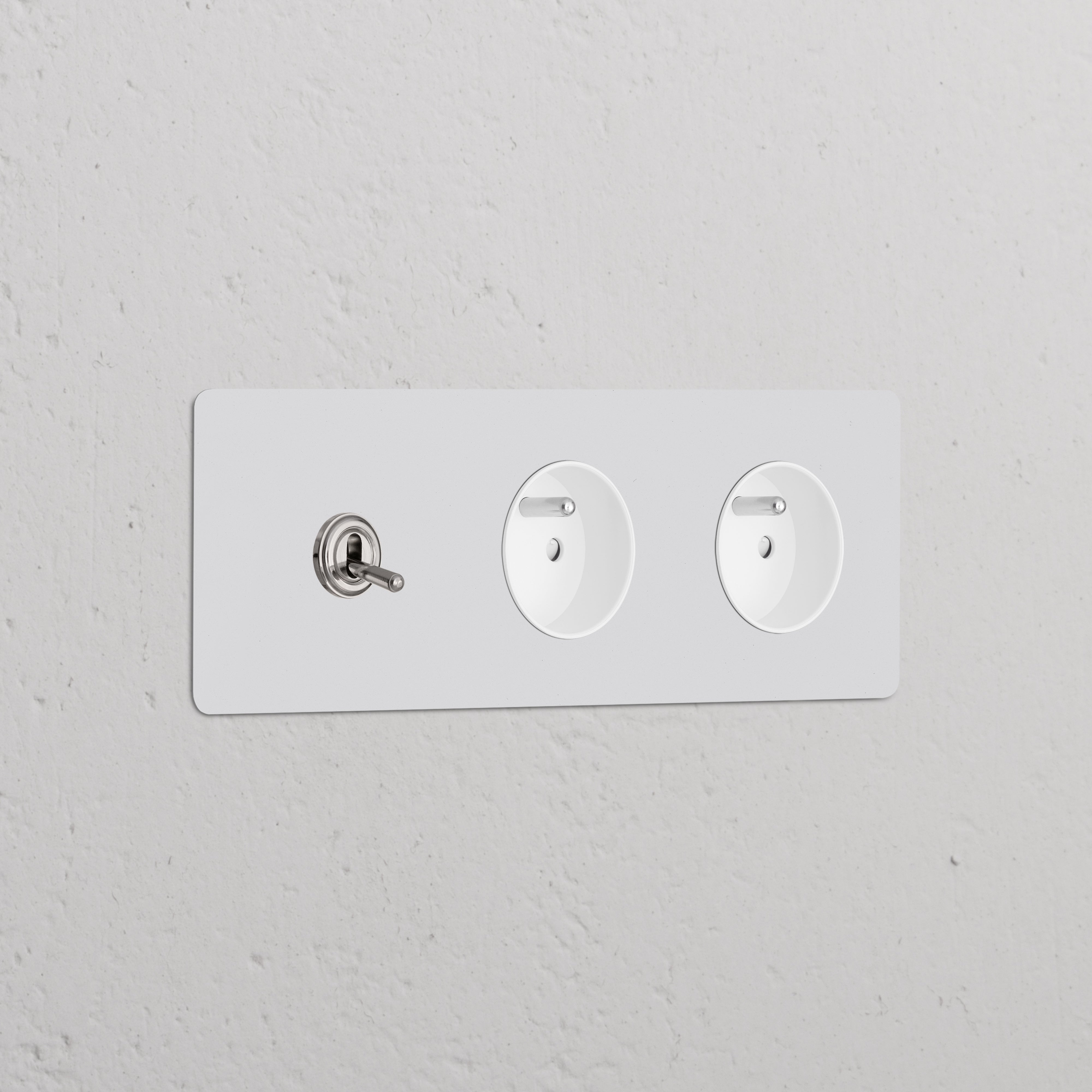 Triple toggle switch panel with 2 Type E sockets, polished nickel white, paintable for decor integration.