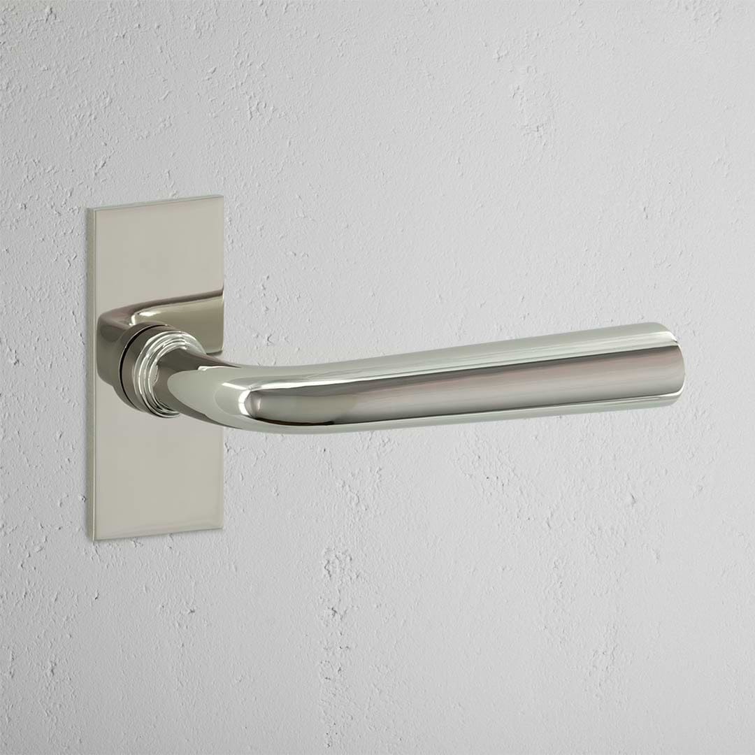 Apsley Short Plate Sprung Door Handle Polished Nickel Finish on White Background