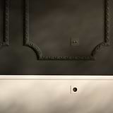 Paintable black Schuko Type F power module, single socket with round design, for wall installation.