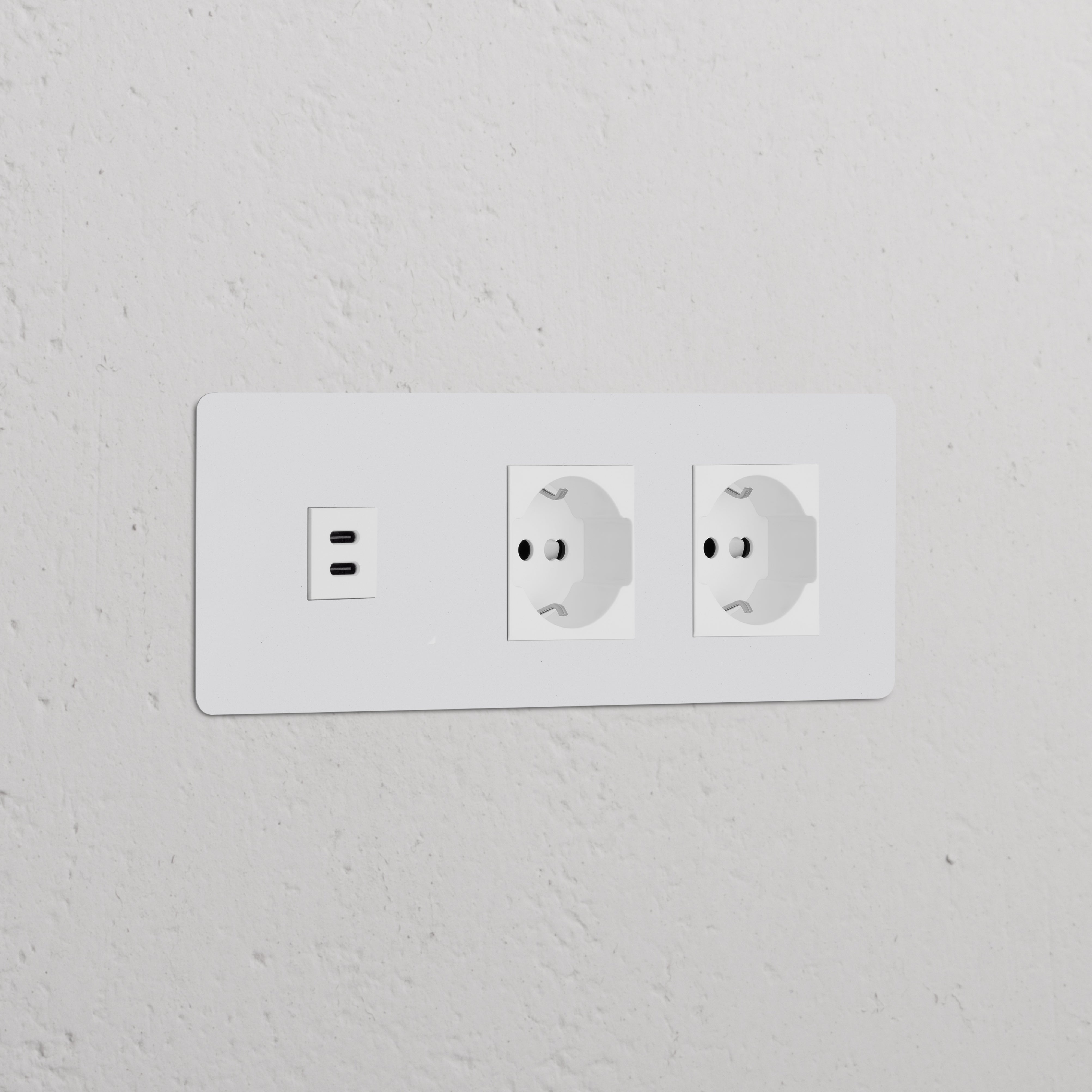 Paintable white module with Triple USB 30W and dual Schuko/Bipasso sockets for seamless installation.