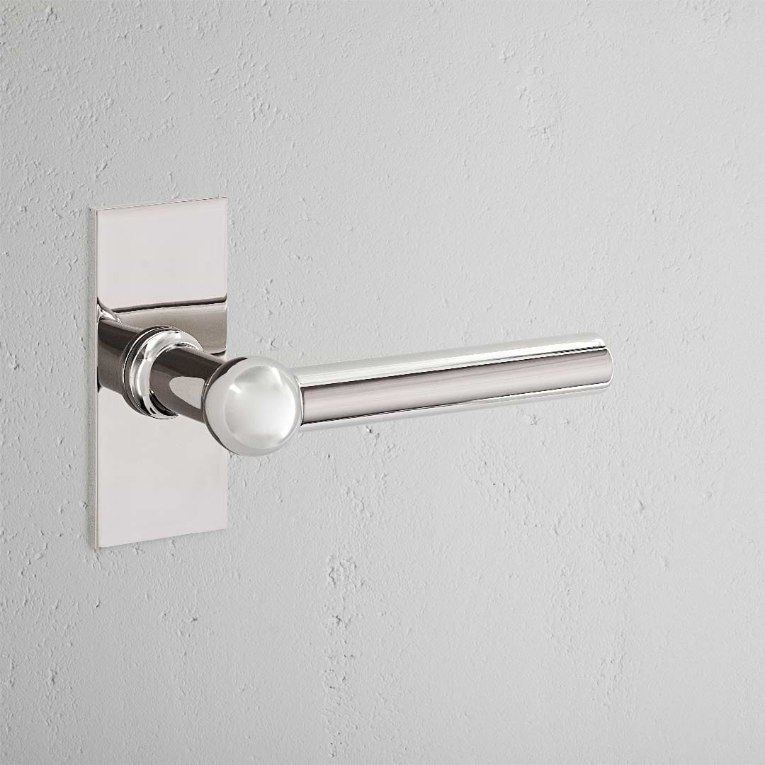 Harper Short Plate Sprung Door Handle Polished Nickel Finish on White Background