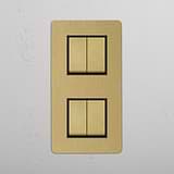 Four-Switch Vertical Double Rocker, Antique Brass Black Hue on White Background