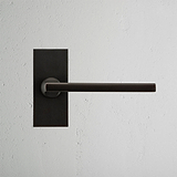 Clayton Short Plate Sprung Door Handle Bronze Finish on White Background Front Facing