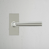 Apsley Short Plate Sprung Door Handle Polished Nickel Finish on White Background Front Facing